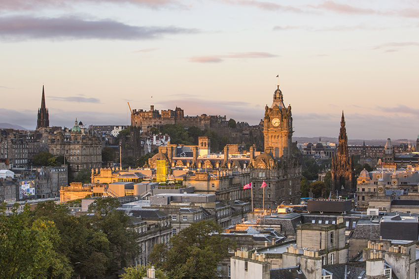 Edinburgh Castle and the Balmoral Hotel clocktower at sunrise
